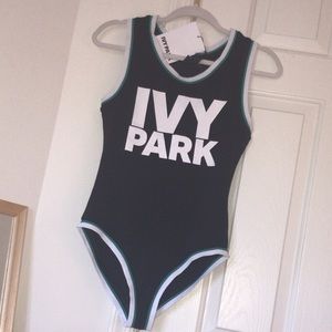 Ivy Park Bodysuit with green stripe.